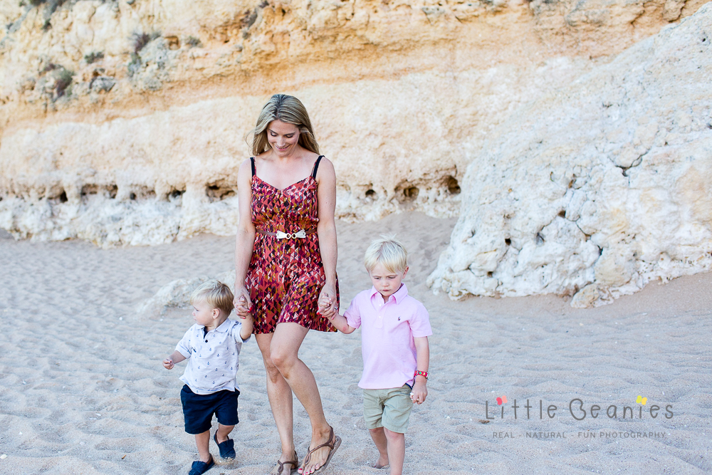 Lisa Jordan walking on the beach with her two boys very happy and content