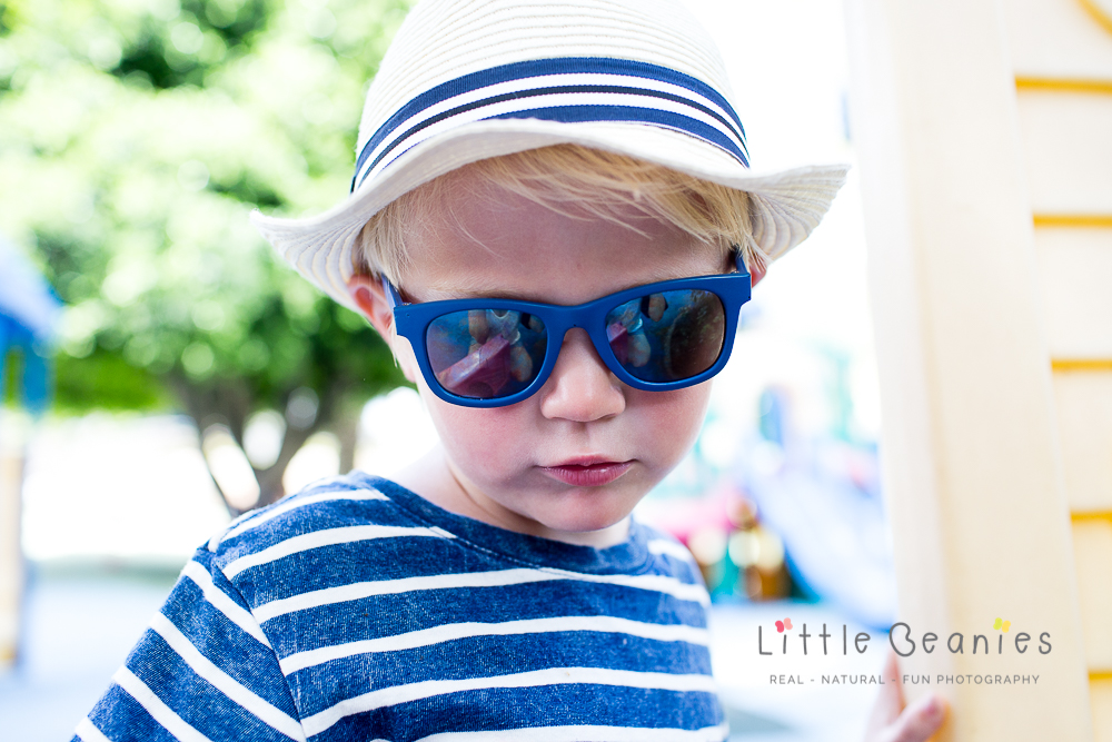 Boy looking cool in sunglasses and hat