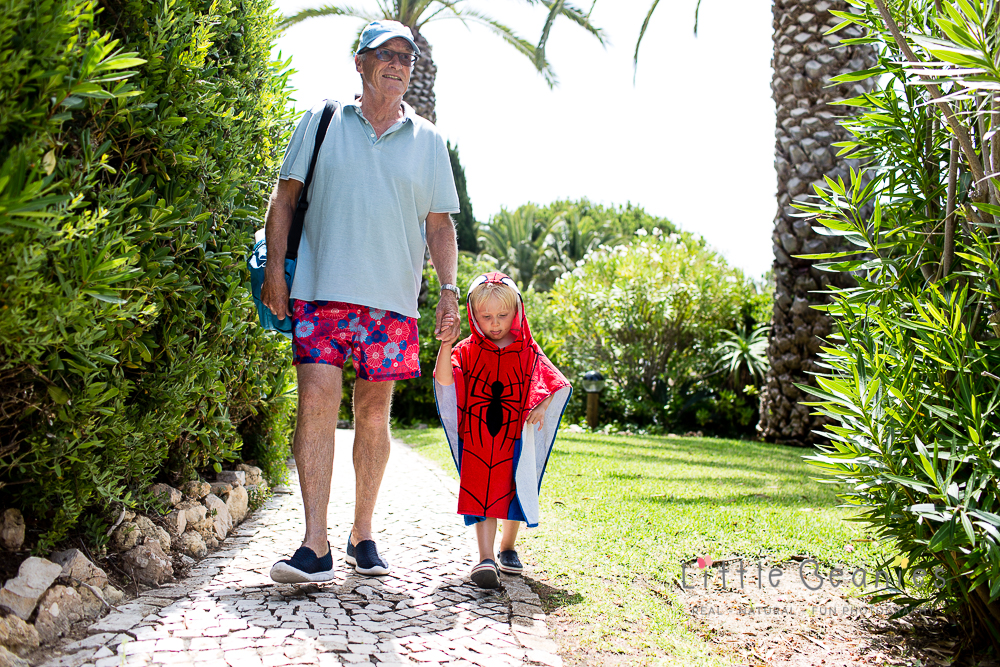 Grandson and Grandfather walking on holiday