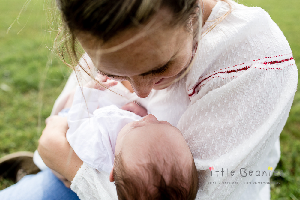 mum and baby touching noses at newborn photoshoot kenilworth