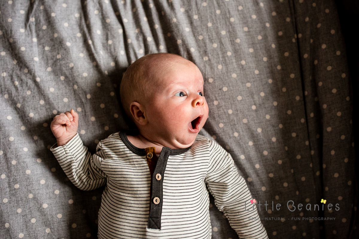 Newborn baby having a yawn