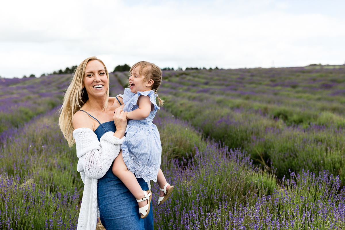 mum and daughter in field of lavender laughing