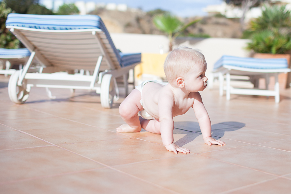 baby boy learning to crawl