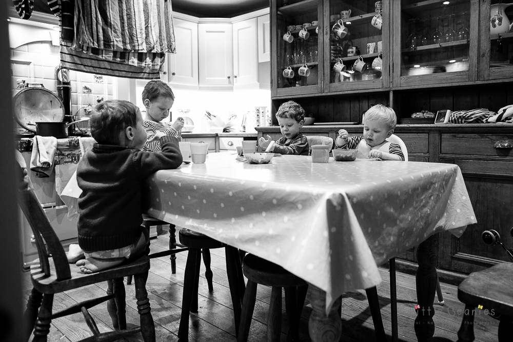 triplets and louis having dinner around the table