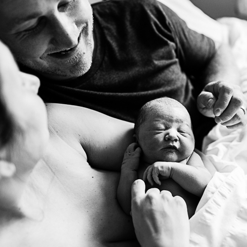 mum dad and baby just minutes old after having home birth